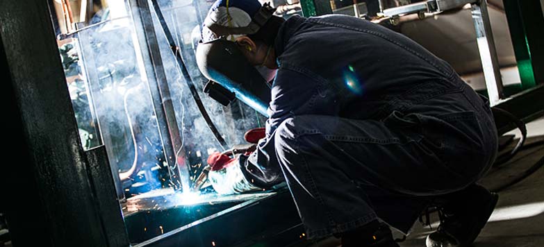 Welder working on a Berg chilling system