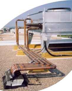 Roof mounted condenser with copper process piping